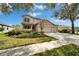 Charming two-story home featuring a spacious driveway and well-manicured landscaping at 6308 Bridgevista Dr, Lithia, FL 33547