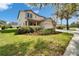 Charming two-story home featuring a spacious driveway and a manicured lawn at 6308 Bridgevista Dr, Lithia, FL 33547