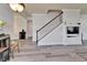 Bright living room with wood floors, staircase, and open concept at 6308 Bridgevista Dr, Lithia, FL 33547