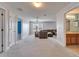 Spacious, carpeted bonus room with natural light and ceiling fan at 6308 Bridgevista Dr, Lithia, FL 33547