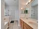 The main bathroom features a double sink vanity, a walk-in shower with a glass door and a soaking tub at 6308 Bridgevista Dr, Lithia, FL 33547