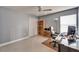 Home office featuring a large desk, comfortable chair, built-in bookcase, and a neutral color scheme at 6308 Bridgevista Dr, Lithia, FL 33547