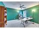 This office features bright green walls, a ceiling fan, shelving, and a table at 6308 Bridgevista Dr, Lithia, FL 33547