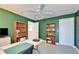 This office features bright green walls, shelving, and white doors at 6308 Bridgevista Dr, Lithia, FL 33547