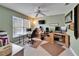 This office features green walls, a window, a ceiling fan, and two computer desks at 6308 Bridgevista Dr, Lithia, FL 33547