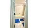 Small bathroom featuring a tub/shower combo, toilet, and blue rugs at 6826 Stones Throw N Cir # 11305, St Petersburg, FL 33710