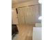 Bedroom featuring a closet with doors and wood-look flooring, offering ample storage and a cozy feel at 6826 Stones Throw N Cir # 11305, St Petersburg, FL 33710