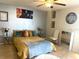 Bright bedroom featuring a queen bed, side table, and neutral walls at 6826 Stones Throw N Cir # 11305, St Petersburg, FL 33710