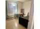 Spacious bedroom with natural light, hardwood floors, and stylish decor at 6826 Stones Throw N Cir # 11305, St Petersburg, FL 33710
