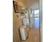 Bright hallway featuring neutral flooring, white accents, and a clear view to the window at 6826 Stones Throw N Cir # 11305, St Petersburg, FL 33710
