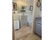 Bright hallway featuring neutral flooring, white accents, and clear view to the adjacent room at 6826 Stones Throw N Cir # 11305, St Petersburg, FL 33710