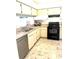 Functional kitchen with stainless steel appliances, granite countertops, and a double sink at 6826 Stones Throw N Cir # 11305, St Petersburg, FL 33710