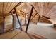 Spacious attic featuring wooden beams, skylight, and unique layout at 701 S Edison Ave, Tampa, FL 33606