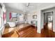 Bright bathroom featuring a clawfoot tub, tile floors, and a mirrored vanity at 701 S Edison Ave, Tampa, FL 33606