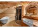 Bathroom featuring a shower, tub, sink, and mirror with wood paneling at 701 S Edison Ave, Tampa, FL 33606