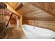 Unique attic bathroom with shower and soaking tub at 701 S Edison Ave, Tampa, FL 33606