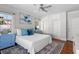 Comfortable bedroom with hardwood floors, ceiling fan, and built-in storage at 701 S Edison Ave, Tampa, FL 33606