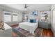 Bright bedroom featuring hardwood floors, and large windows at 701 S Edison Ave, Tampa, FL 33606