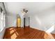 Well-lit bedroom features hardwood floors, a closet, and natural light from the windows at 701 S Edison Ave, Tampa, FL 33606