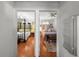 View of two bedrooms featuring hardwood floors, ceiling fans, and neutral color palettes at 701 S Edison Ave, Tampa, FL 33606
