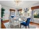 Well-lit dining room with a glass table, comfortable seating, and stylish decor at 701 S Edison Ave, Tampa, FL 33606