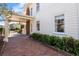 Brick driveway and covered parking area highlight the home's curb appeal and convenient features at 701 S Edison Ave, Tampa, FL 33606