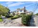 Exterior of a charming two-story home with mature landscaping and a well-manicured lawn at 701 S Edison Ave, Tampa, FL 33606