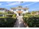 A beautiful two-story home, enhanced by lush greenery and clear blue skies at 701 S Edison Ave, Tampa, FL 33606
