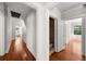 Hallway showcasing hardwood floors, and multiple doorways leading to other rooms at 701 S Edison Ave, Tampa, FL 33606