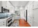 Bright kitchen with white cabinets, stainless steel appliances, an undermount sink and a window view at 701 S Edison Ave, Tampa, FL 33606