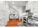 Kitchen featuring breakfast nook, white cabinets, granite countertops and stainless steel appliances at 701 S Edison Ave, Tampa, FL 33606