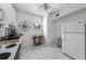 Clean kitchen with white cabinets and marble patterned floors at 701 S Edison Ave, Tampa, FL 33606