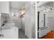 Efficient laundry room with a washer, dryer, freezer, storage space and access to the kitchen at 701 S Edison Ave, Tampa, FL 33606