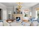 Inviting living room with a fireplace, comfortable seating, hardwood floors, and a cozy atmosphere at 701 S Edison Ave, Tampa, FL 33606