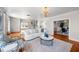 Elegant living room featuring hardwood floors, comfortable seating, and an open layout at 701 S Edison Ave, Tampa, FL 33606