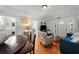 Open living room with a blue sofa and hardwood floors at 701 S Edison Ave, Tampa, FL 33606