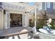 Covered outdoor patio featuring stone pavers and an adjacent seating area, perfect for outdoor entertaining at 701 S Edison Ave, Tampa, FL 33606