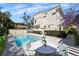 Inviting pool and patio area with lounge chairs surrounded by lush landscaping perfect for outdoor relaxation at 701 S Edison Ave, Tampa, FL 33606