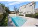 Refreshing pool with clear blue water and surrounding patio creating a backyard oasis at 701 S Edison Ave, Tampa, FL 33606