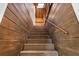 Wood-paneled stairway with carpet and wooden handrail at 701 S Edison Ave, Tampa, FL 33606