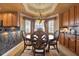 Dining room with wood table, elegant chairs, and natural light at 7040 Key Haven Rd # 606, Seminole, FL 33777