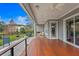 Spacious covered patio boasts an outdoor kitchen, stylish ceiling fan, and a clear view of the backyard at 7820 Marsh Pointe Dr, Tampa, FL 33635