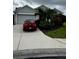 Charming single-story home with well-manicured landscaping, a driveway and an attached garage at 8214 Tabbystone Pl, Bradenton, FL 34201