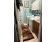 Functional laundry room with washer, dryer, storage cabinets, and a utility sink at 8214 Tabbystone Pl, Bradenton, FL 34201