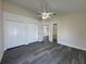 Bedroom featuring ceiling fan, dual closets, and ensuite bathroom at 8229 Riverboat Dr, Tampa, FL 33637