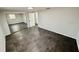 This bedroom features dark tile flooring and a closet with mirrored sliding doors at 8708 Robilina Rd, Port Richey, FL 34668