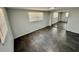 Bedroom featuring a large mirrored closet, sleek tile flooring, and neutral paint at 8708 Robilina Rd, Port Richey, FL 34668