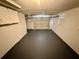 Spacious garage offering ample room for parking and storage, with an automatic door at 8708 Robilina Rd, Port Richey, FL 34668