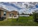 View of a spacious backyard featuring a deck and seating area, perfect for outdoor entertaining at 9211 Seeger Ln, Land O Lakes, FL 34638