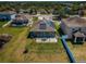 A well-maintained backyard featuring a patio, partial fence, and an exterior view of the installed solar panels at 9211 Seeger Ln, Land O Lakes, FL 34638